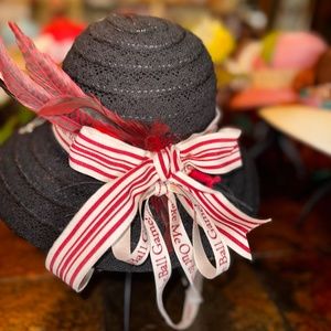 Jane and Berry, black hat with Embellishment Silver Can Tab and Gamecock Feather